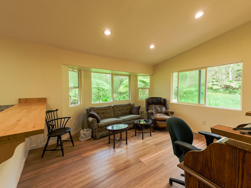 1 9th Street Mountain View, HI 96771 - Photo 5 of 21 a living room with furniture and a wooden floor