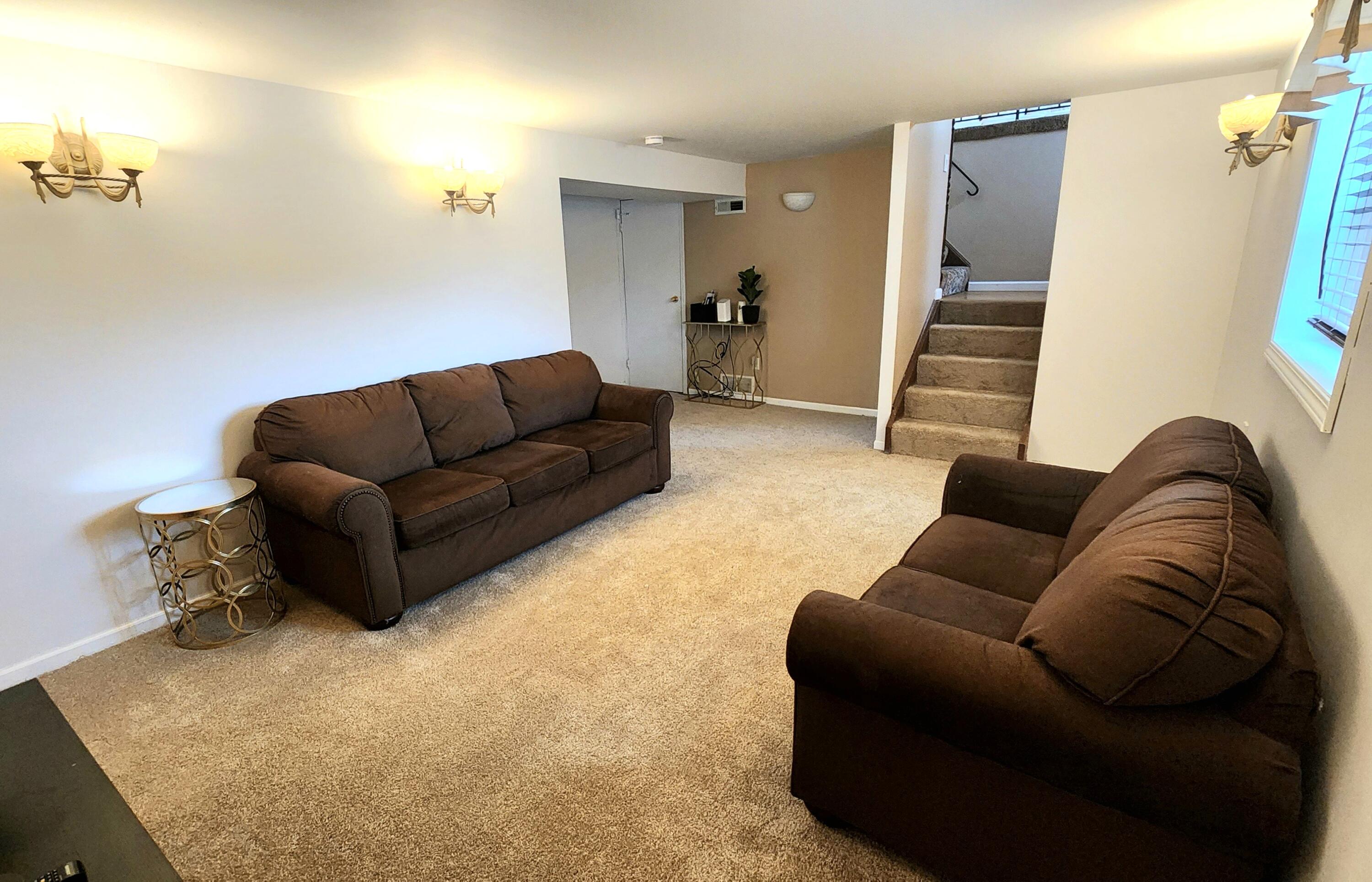 7315 Taney Place Merrillville, IN 46410 - Photo 12 of 26 a living room with furniture and stairs