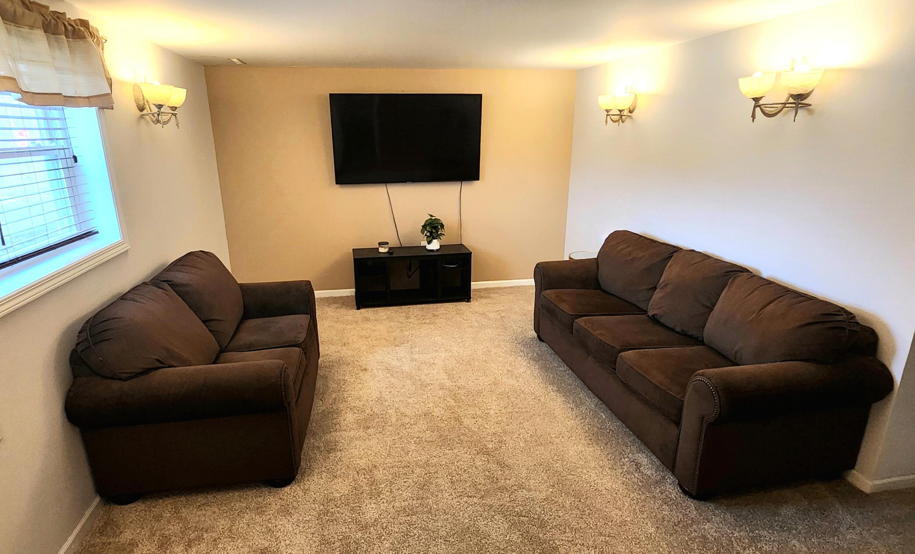 7315 Taney Place Merrillville, IN 46410 - Photo 13 of 26 a living room with furniture and a flat screen tv
