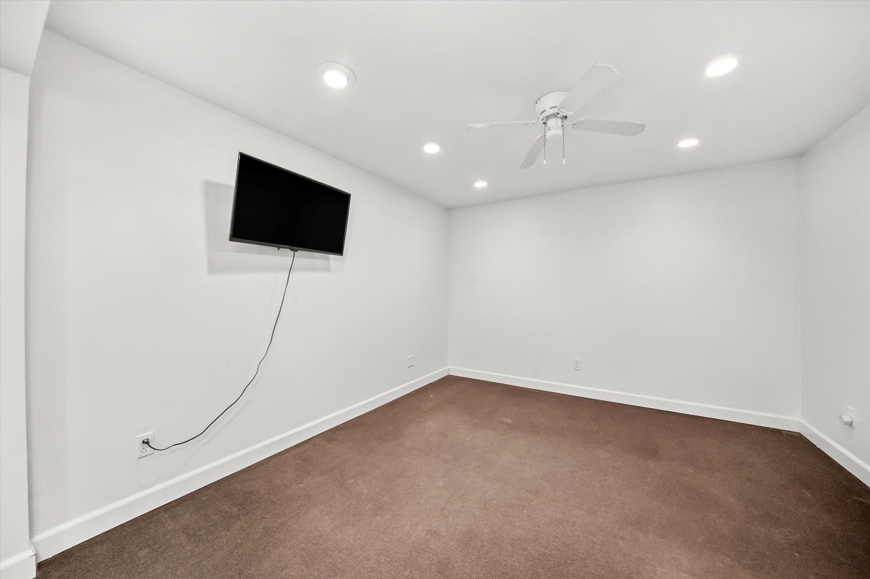 7315 Taney Place Merrillville, IN 46410 - Photo 16 of 26 an empty room with wooden floor and windows