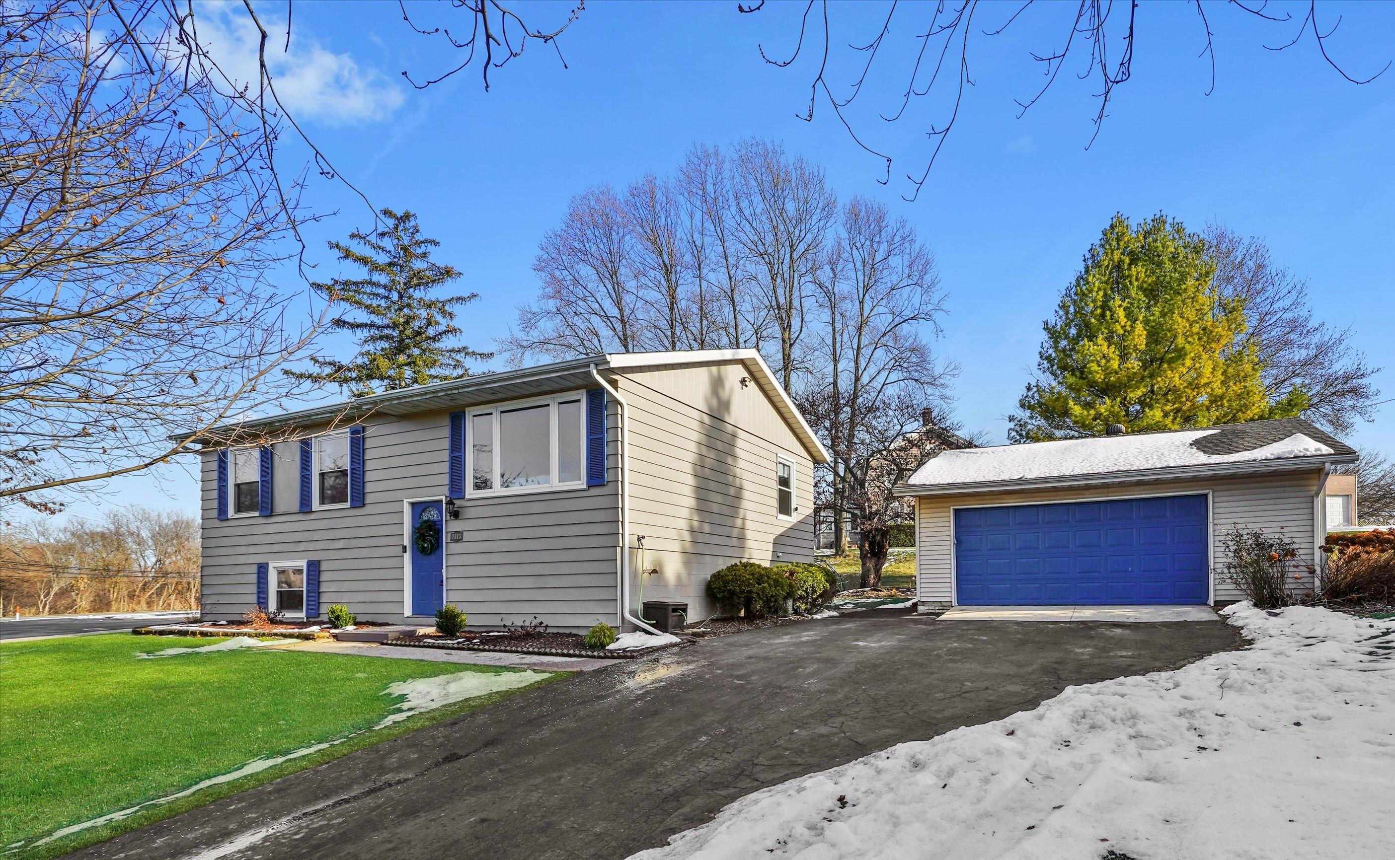 7315 Taney Place Merrillville, IN 46410 - Photo 25 of 26 a front view of a house with a yard