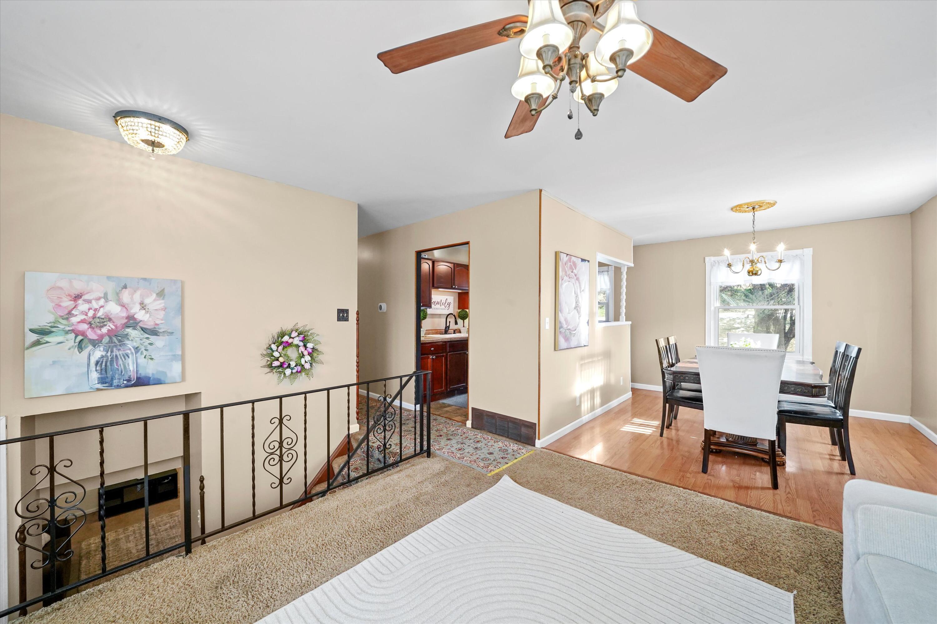 7315 Taney Place Merrillville, IN 46410 - Photo 3 of 26 a living room with furniture and a chandelier