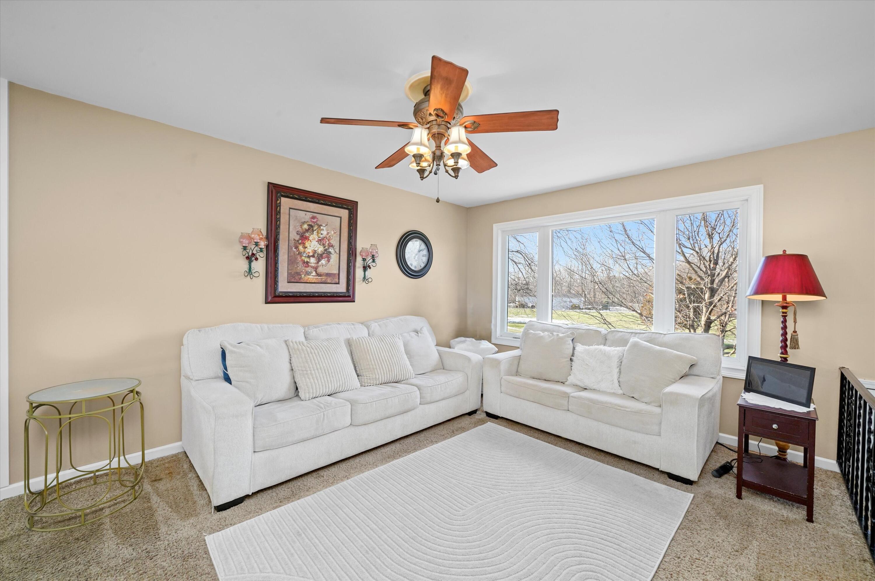 7315 Taney Place Merrillville, IN 46410 - Photo 4 of 26 a living room with furniture and a large window