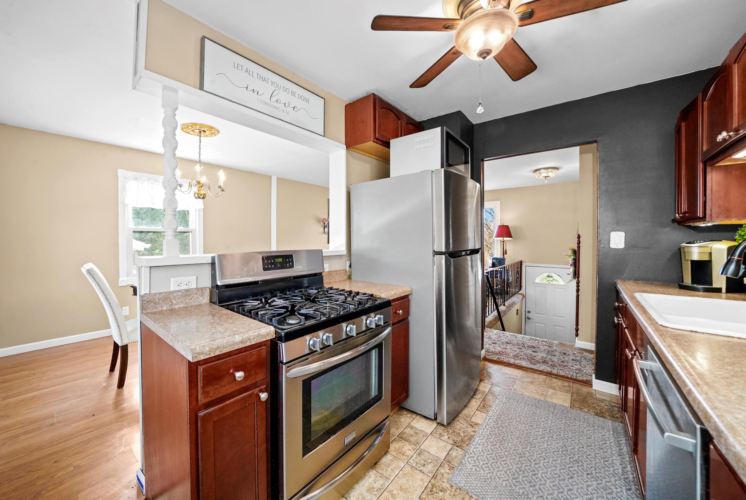 7315 Taney Place Merrillville, IN 46410 - Photo 7 of 26 a kitchen with stainless steel appliances granite countertop a stove and a refrigerator