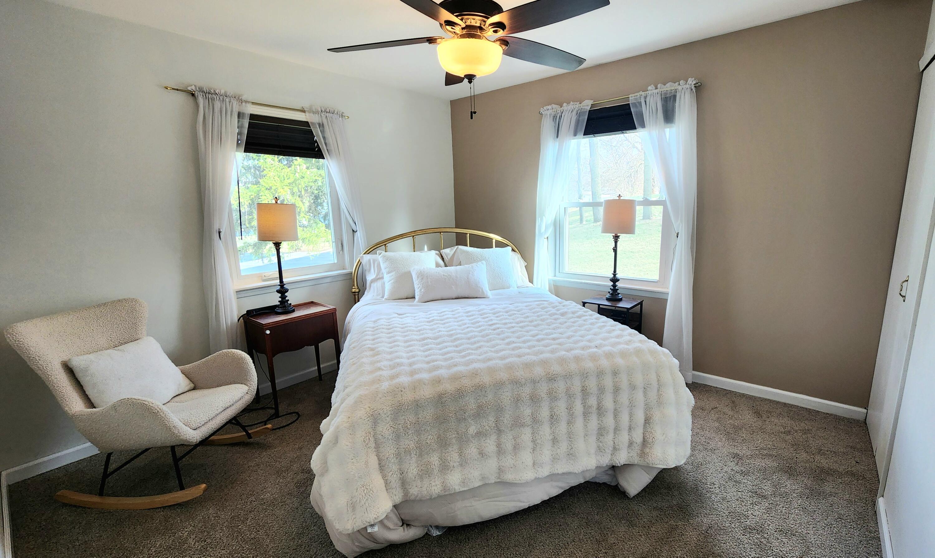 7315 Taney Place Merrillville, IN 46410 - Photo 8 of 26 a bedroom with a bed chairs and a window