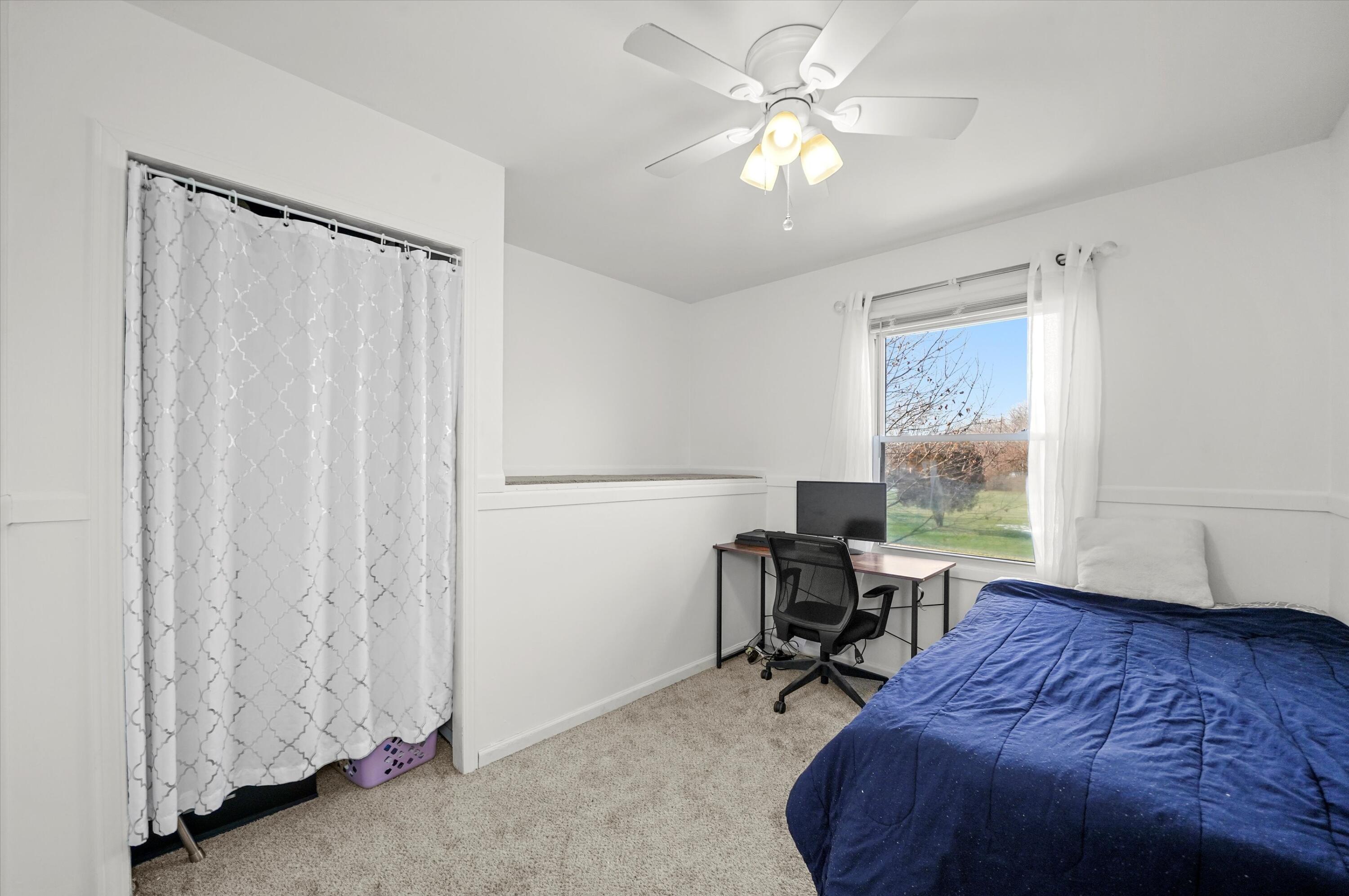 7315 Taney Place Merrillville, IN 46410 - Photo 10 of 26 a bedroom that has a bed and a chair in it