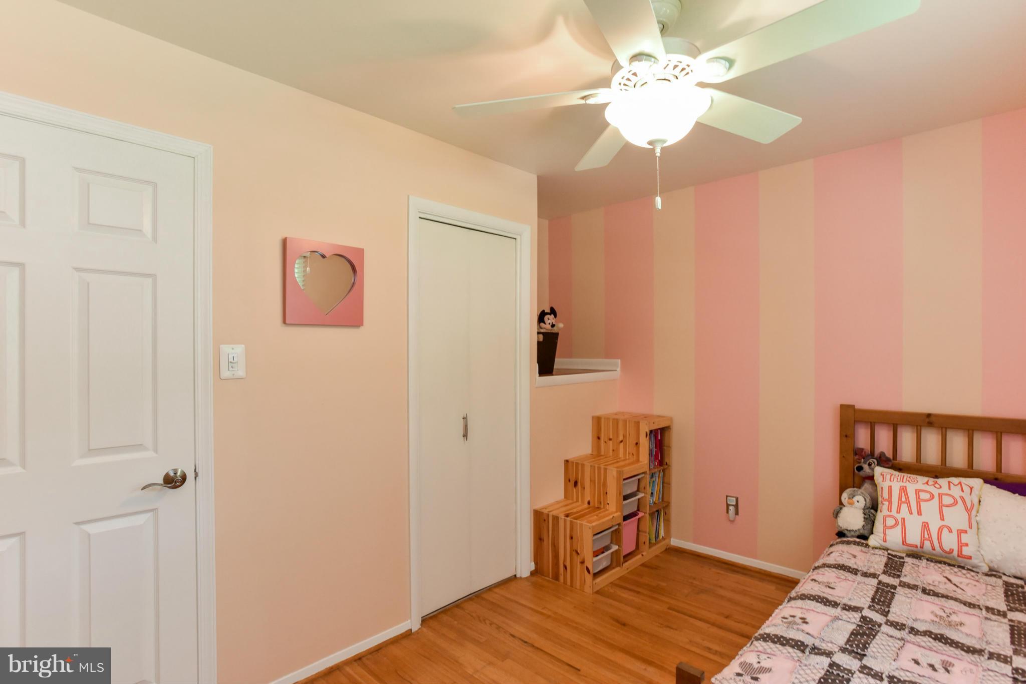 5614 Heming Avenue Springfield, VA 22151 - Photo 13 of 30 a bedroom with a bed and wooden floor