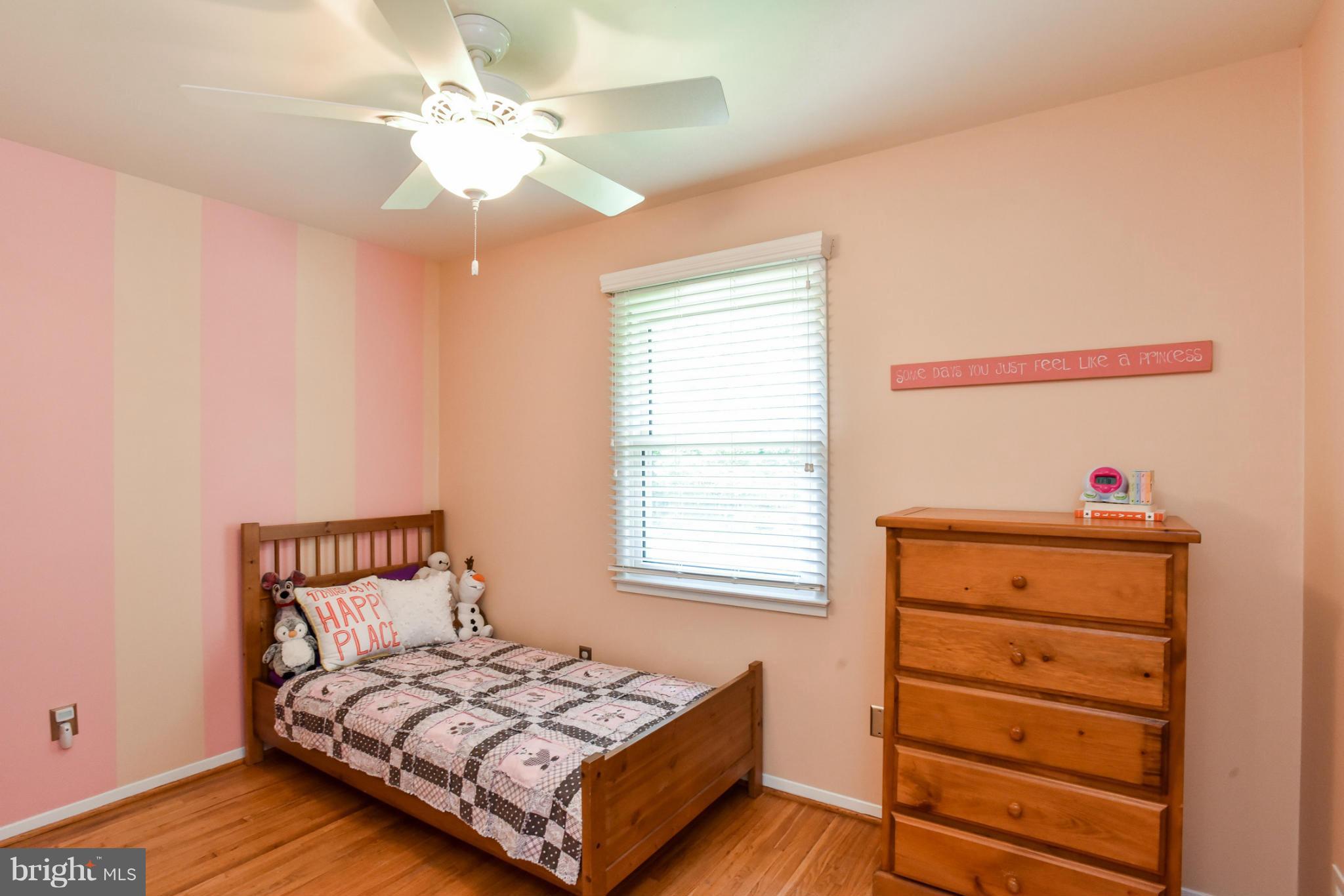 5614 Heming Avenue Springfield, VA 22151 - Photo 14 of 30 a bedroom with a bed and a dresser