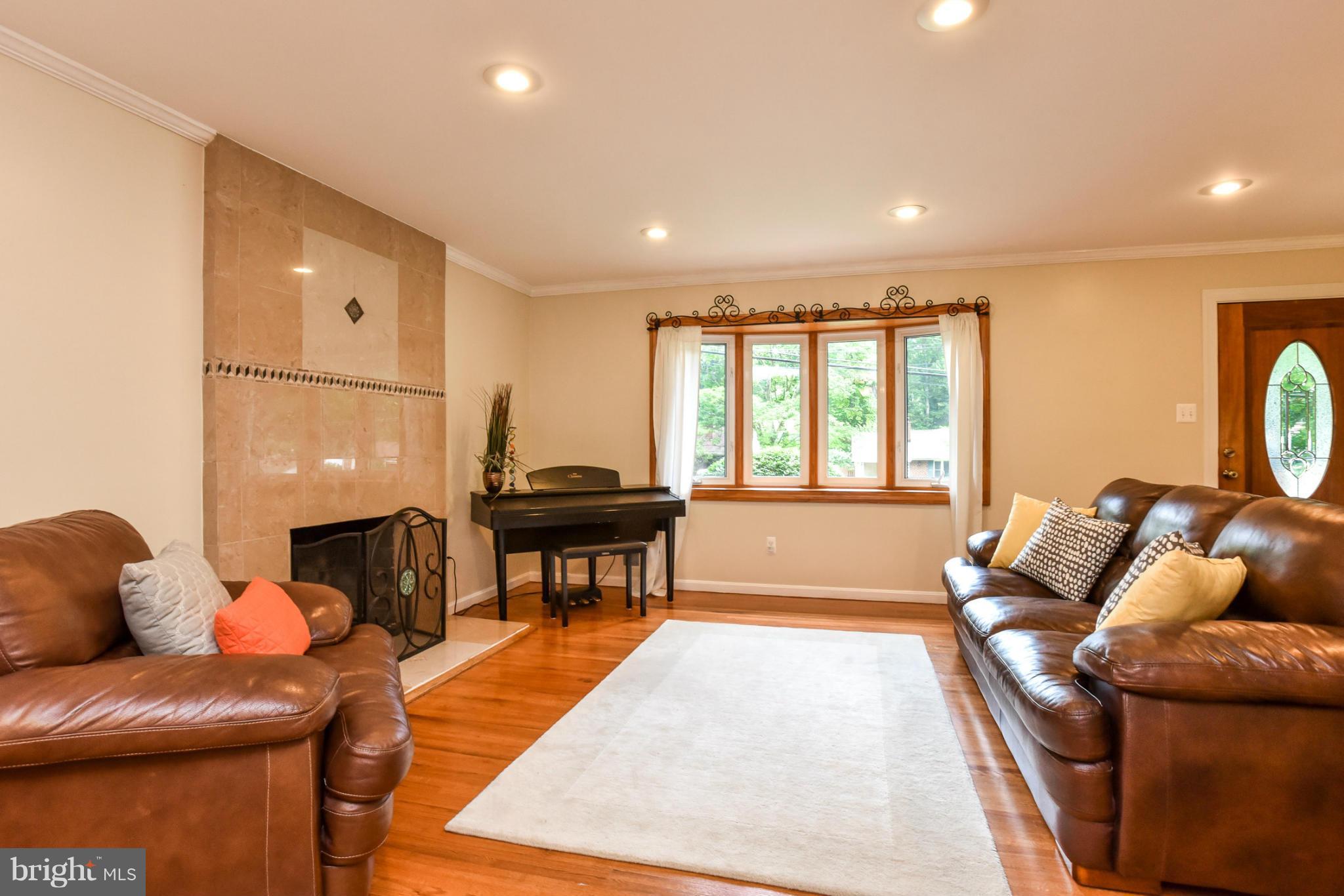 5614 Heming Avenue Springfield, VA 22151 - Photo 3 of 30 a living room with furniture and a fireplace