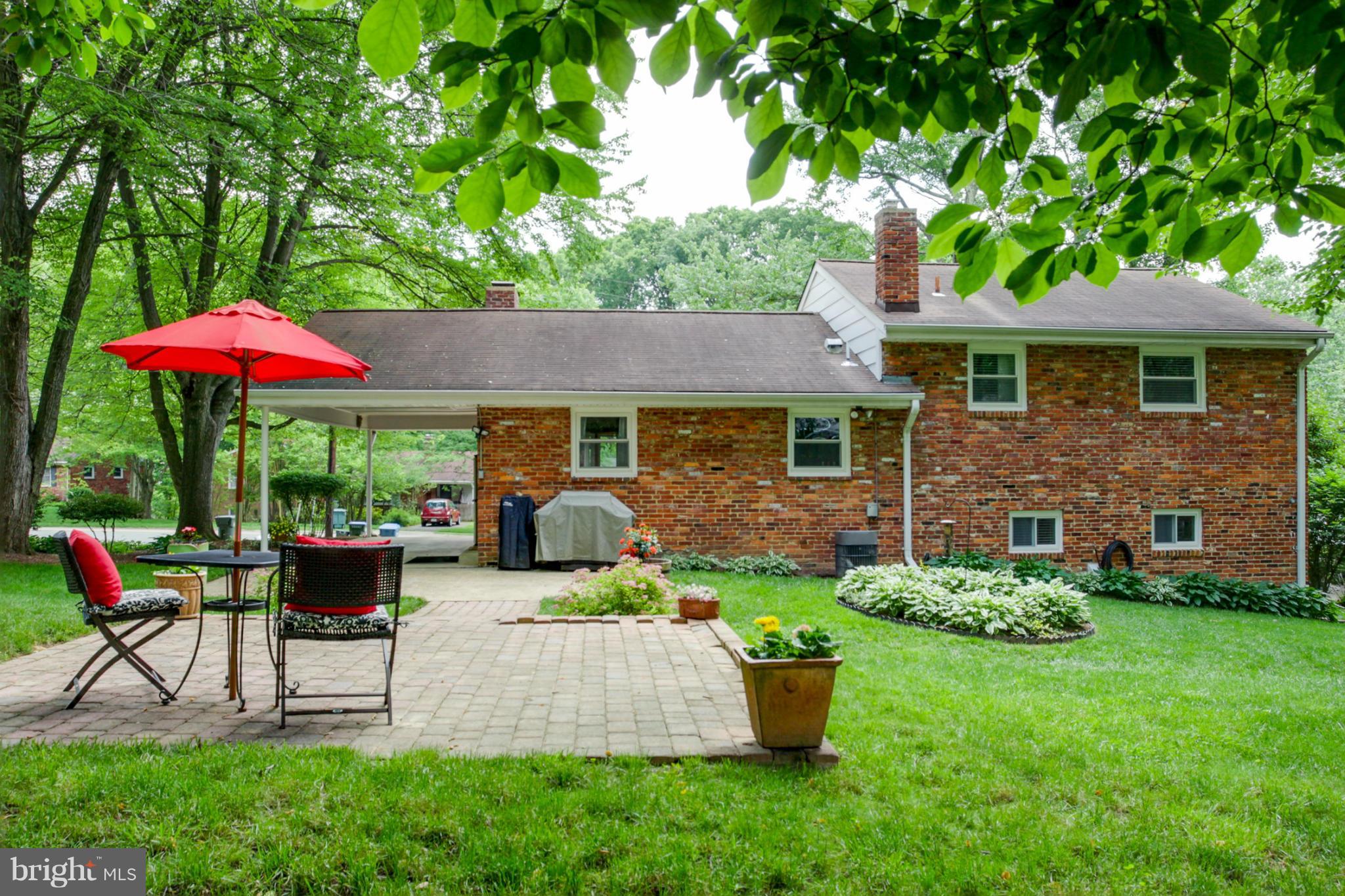 5614 Heming Avenue Springfield, VA 22151 - Photo 21 of 30 a view of a house with backyard sitting area and garden
