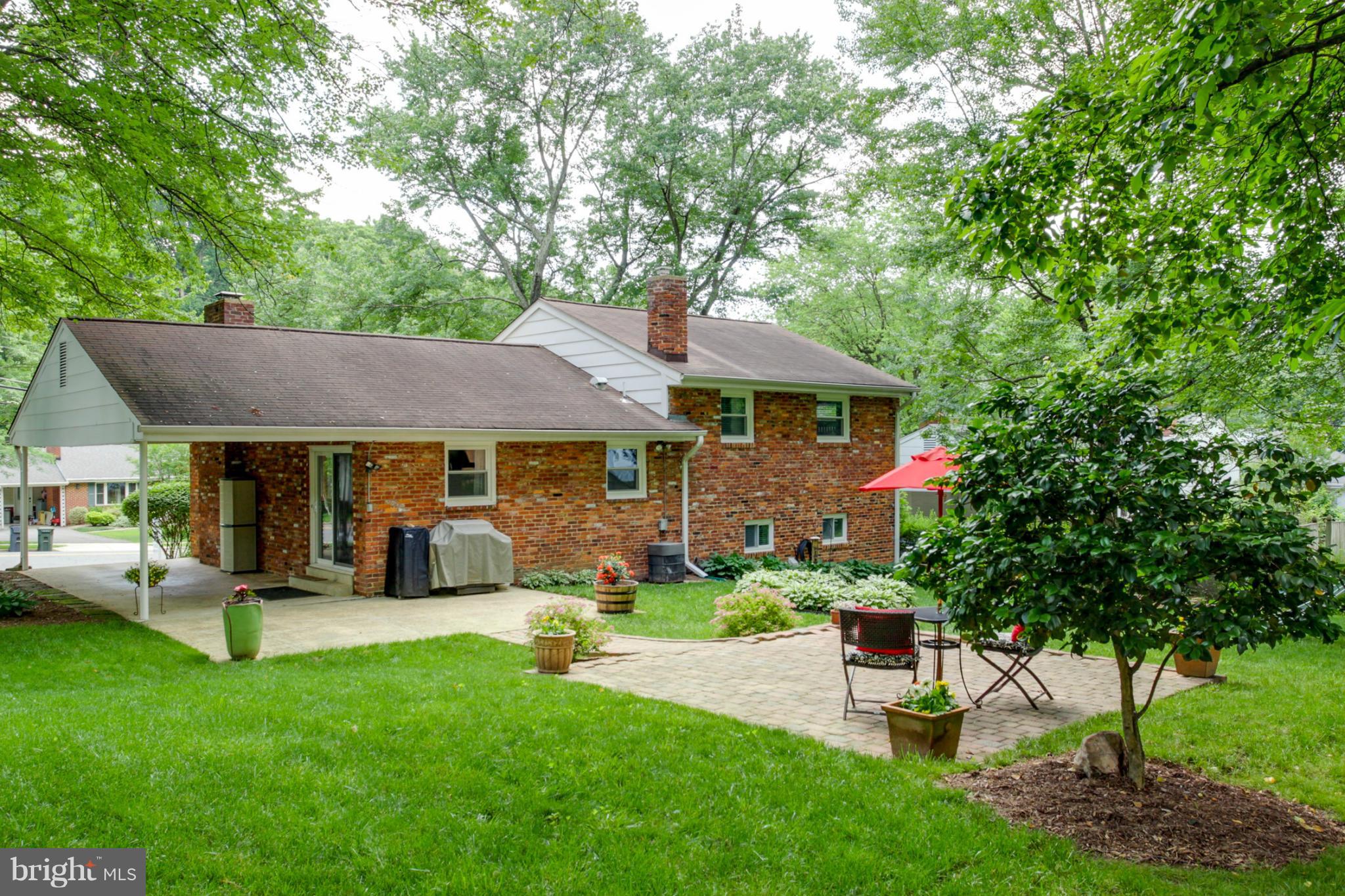 5614 Heming Avenue Springfield, VA 22151 - Photo 22 of 30 a front view of a house with garden
