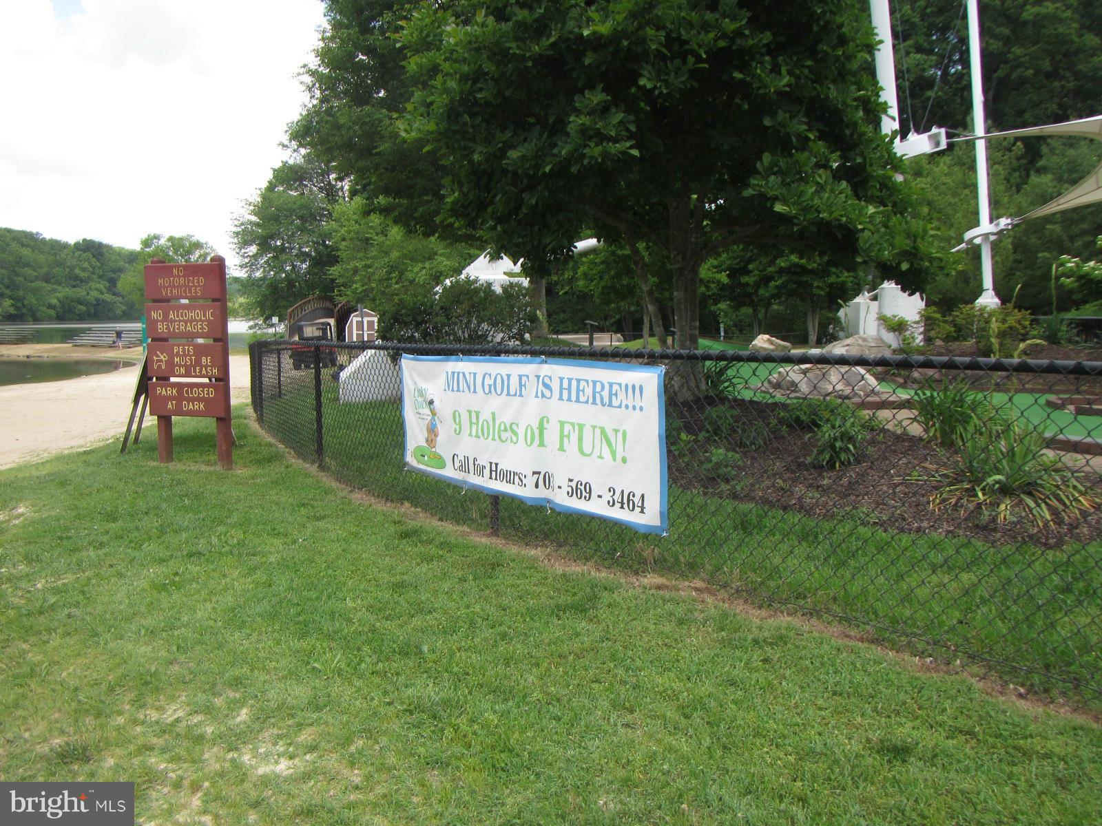 5614 Heming Avenue Springfield, VA 22151 - Photo 28 of 30 a sign that is sitting in the grass near a tree