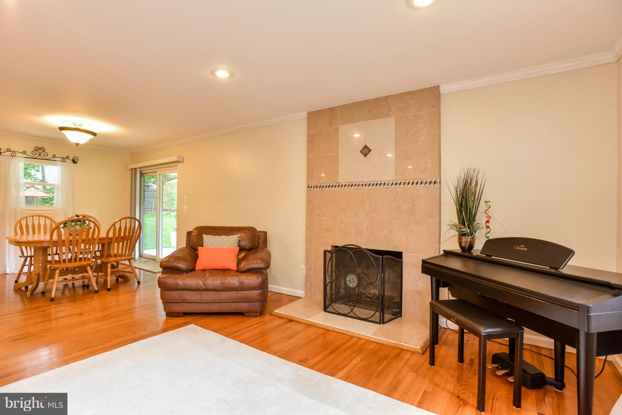 5614 Heming Avenue Springfield, VA 22151 - Photo 4 of 30 a living room with furniture and a fireplace
