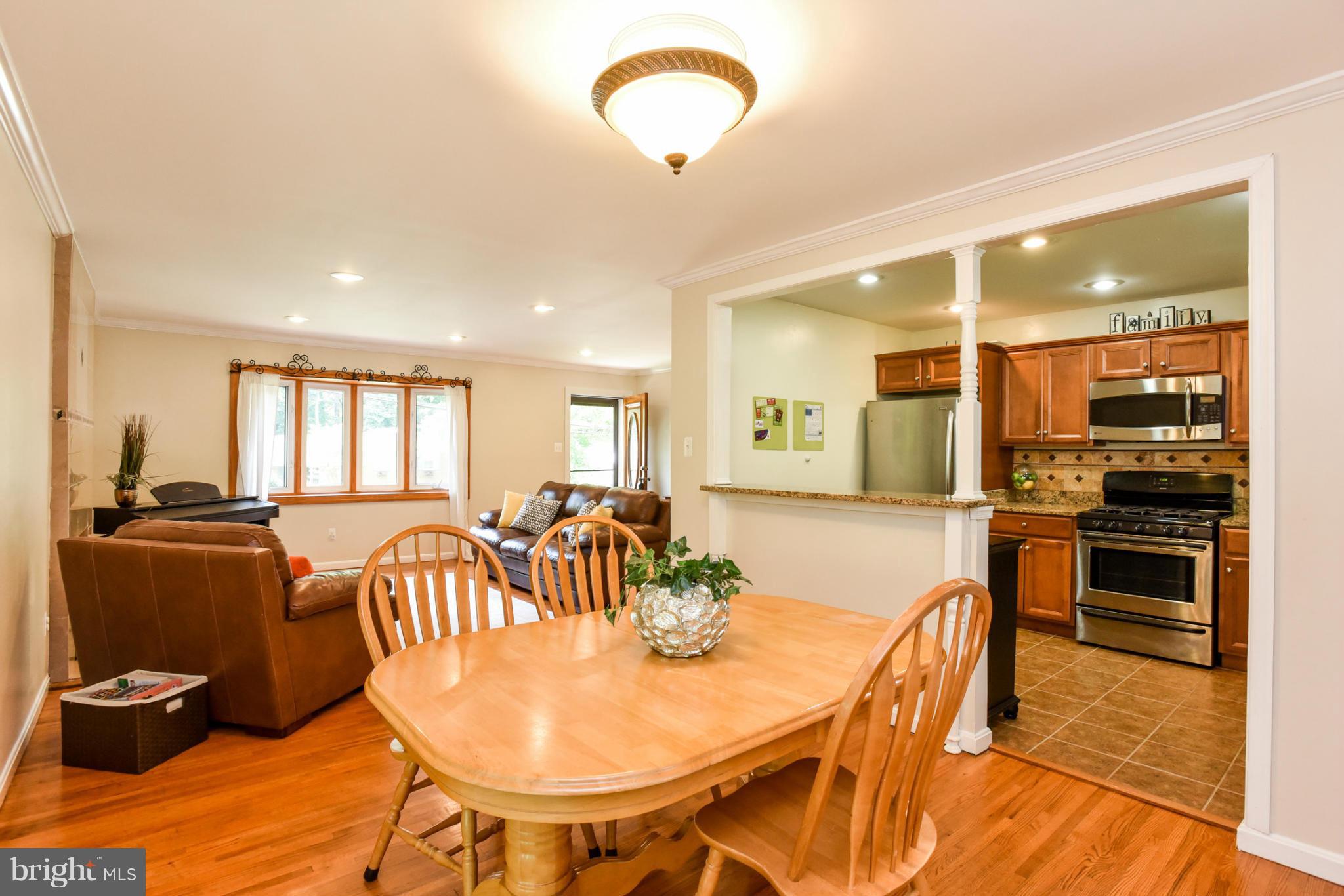 5614 Heming Avenue Springfield, VA 22151 - Photo 5 of 30 a view of a dining room with furniture and a table
