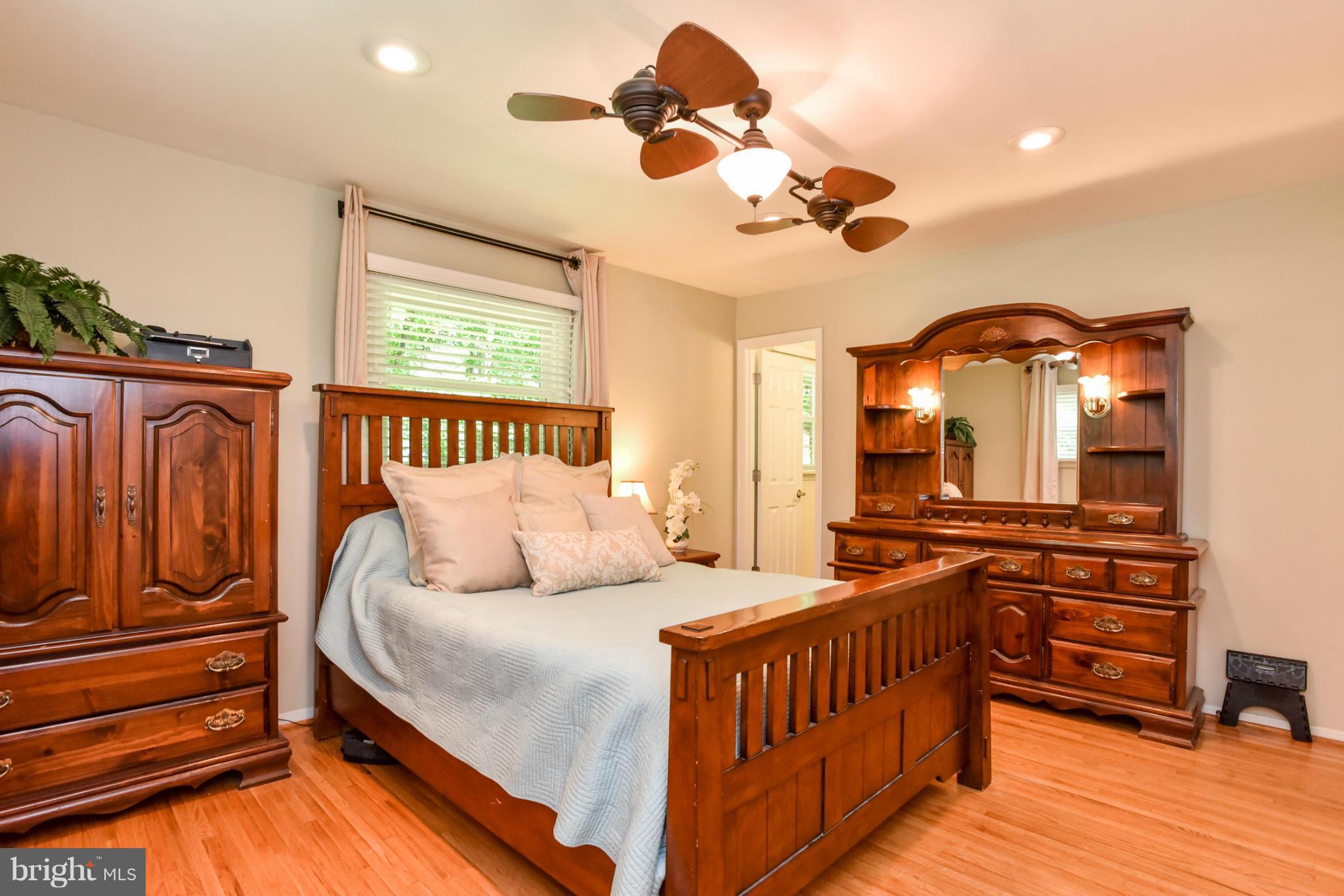 5614 Heming Avenue Springfield, VA 22151 - Photo 9 of 30 a bedroom with a bed and wooden floor