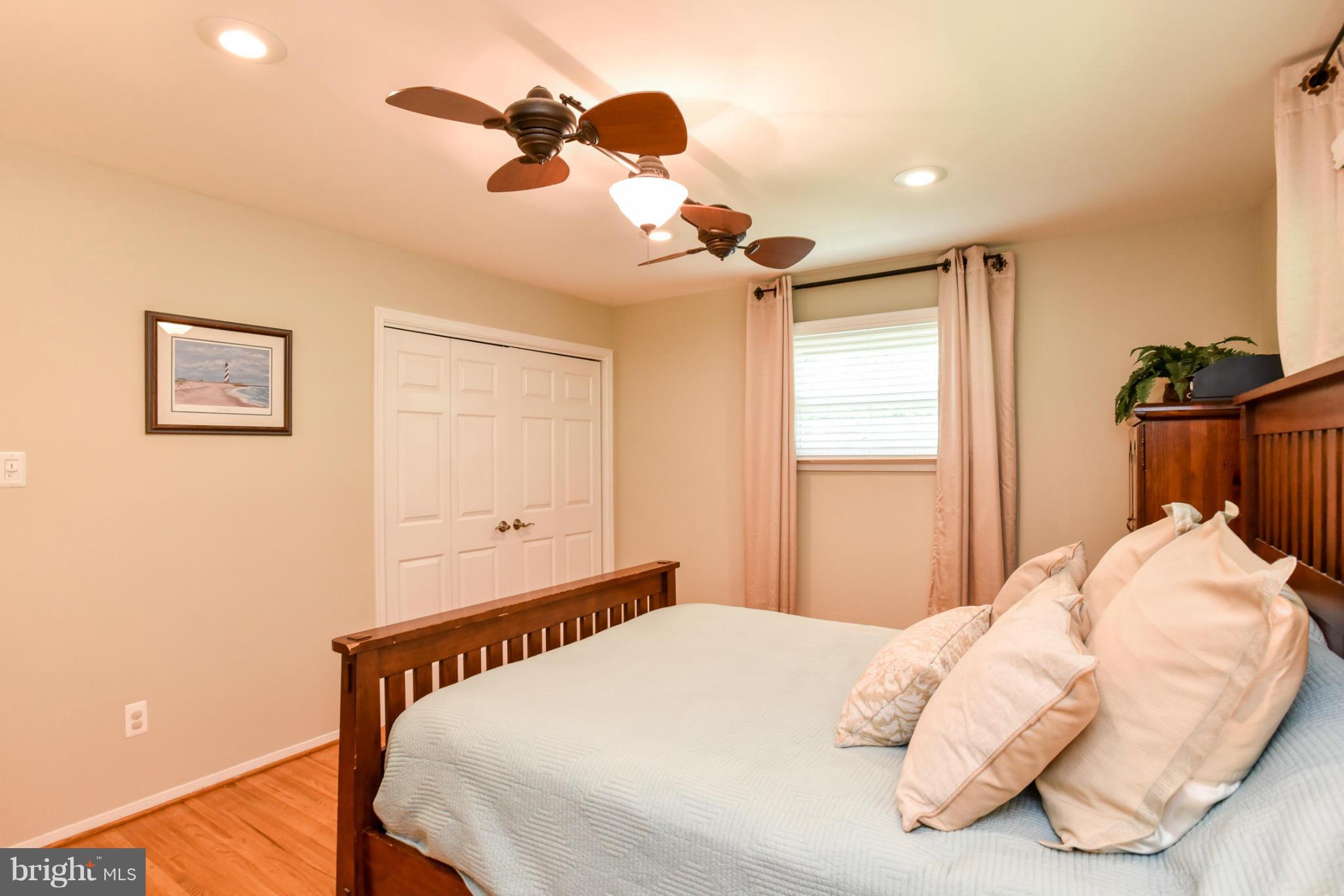 5614 Heming Avenue Springfield, VA 22151 - Photo 10 of 30 a bedroom with a bed and a chandelier