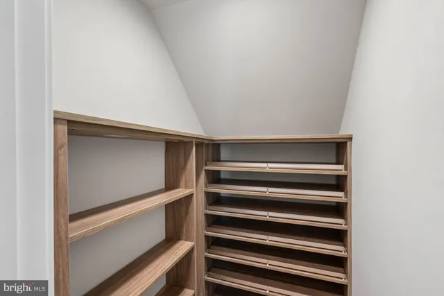 a view of a hallway with windows