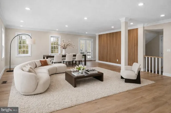 a spacious bedroom with a bed a fireplace and a television