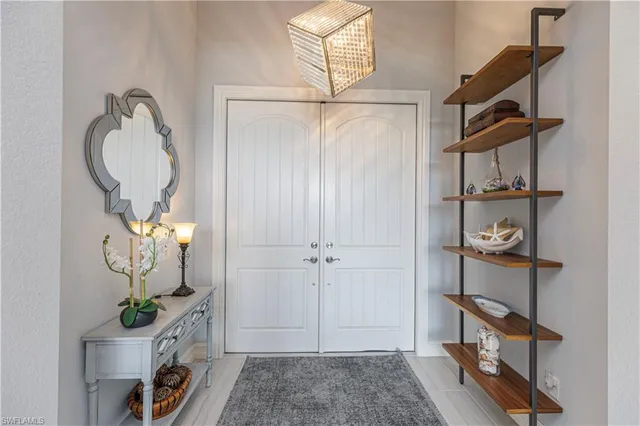 a room with wooden floor and lots of wooden furniture