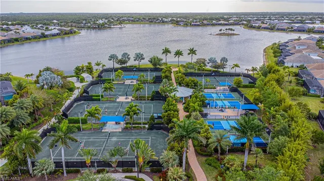 an aerial view of a house with a lake view