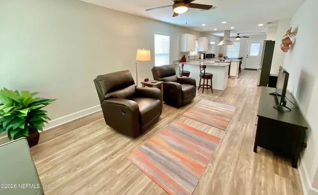 a bedroom with a bed couch and window