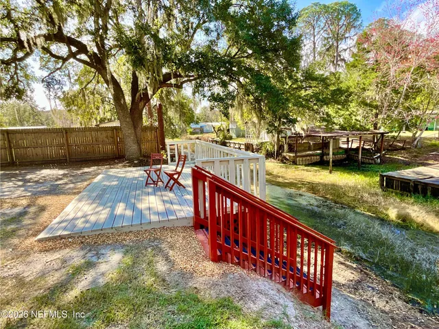 a bedroom with a bed and flat screen tv
