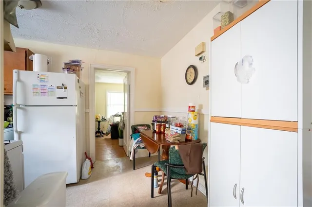 a dining room with furniture and a chandelier