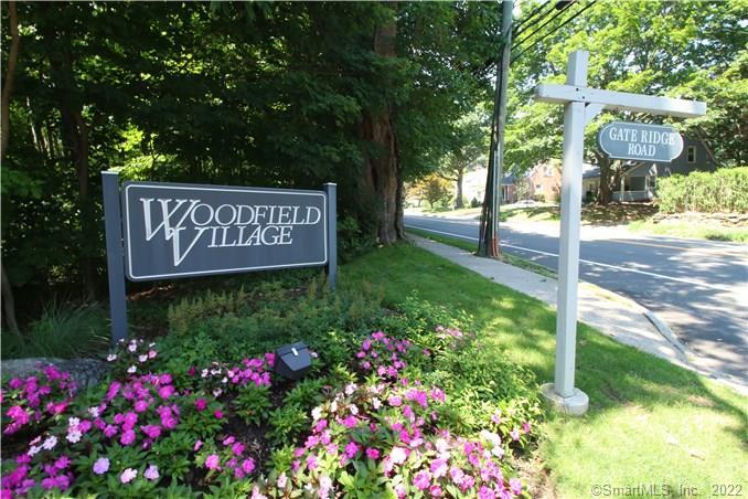 79 Gate Ridge Road, Unit 79 Fairfield, CT 06825 - Photo 1 of 1 a sign on the side of the road
