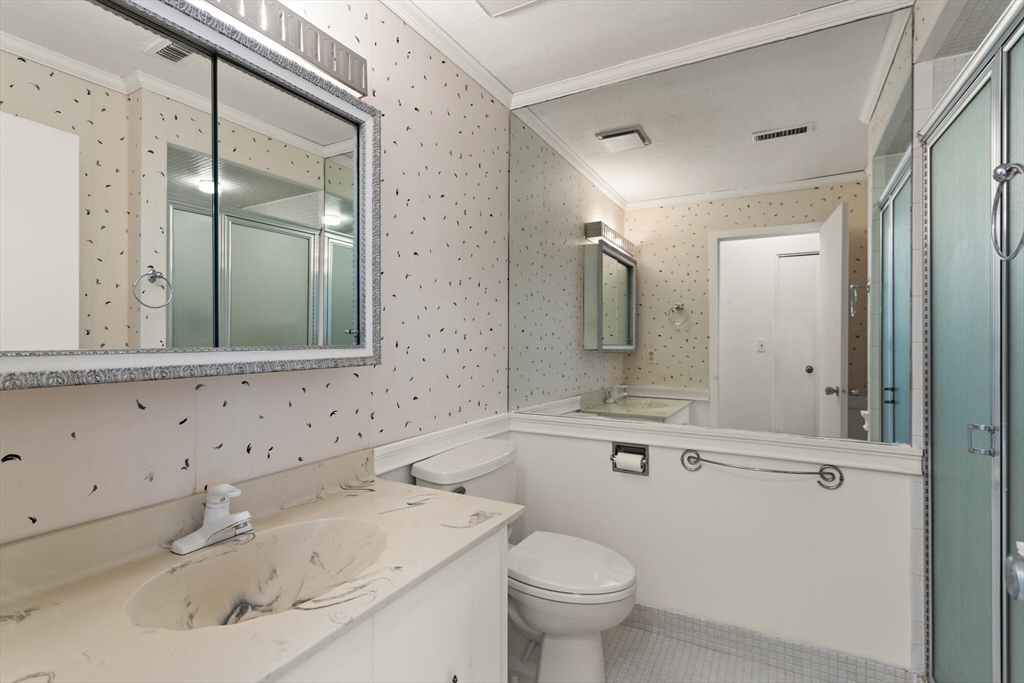 1008 Paradise Road, Unit 2R Swampscott, MA 01907 - Photo 17 of 18 a bathroom with a sink and a mirror