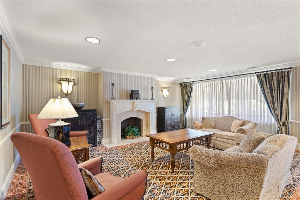 1008 Paradise Road, Unit 2R Swampscott, MA 01907 - Photo 4 of 18 a living room with furniture and a fireplace