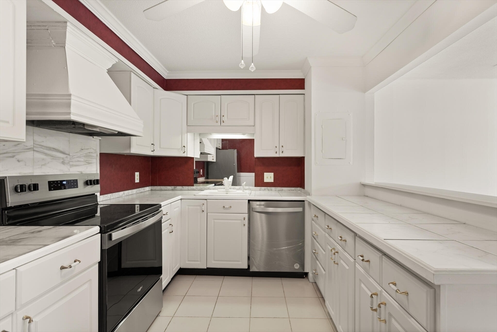 1008 Paradise Road, Unit 2R Swampscott, MA 01907 - Photo 6 of 18 a kitchen that has a sink and a stove in it