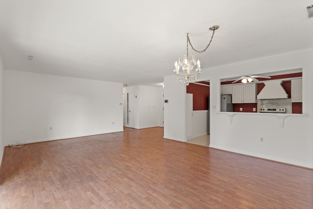 1008 Paradise Road, Unit 2R Swampscott, MA 01907 - Photo 8 of 18 a view of a room with cabinet and chandelier