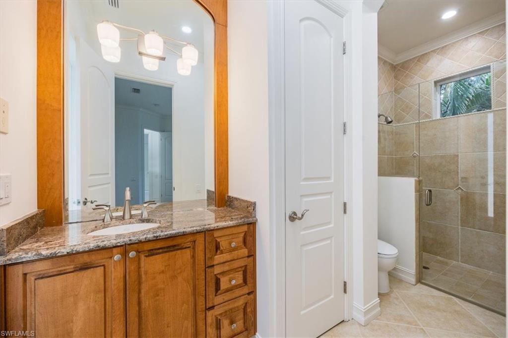 3110 Crayton Road Naples, FL 34103 - Photo 24 of 38 Pool bath with vanity, toilet and shower.