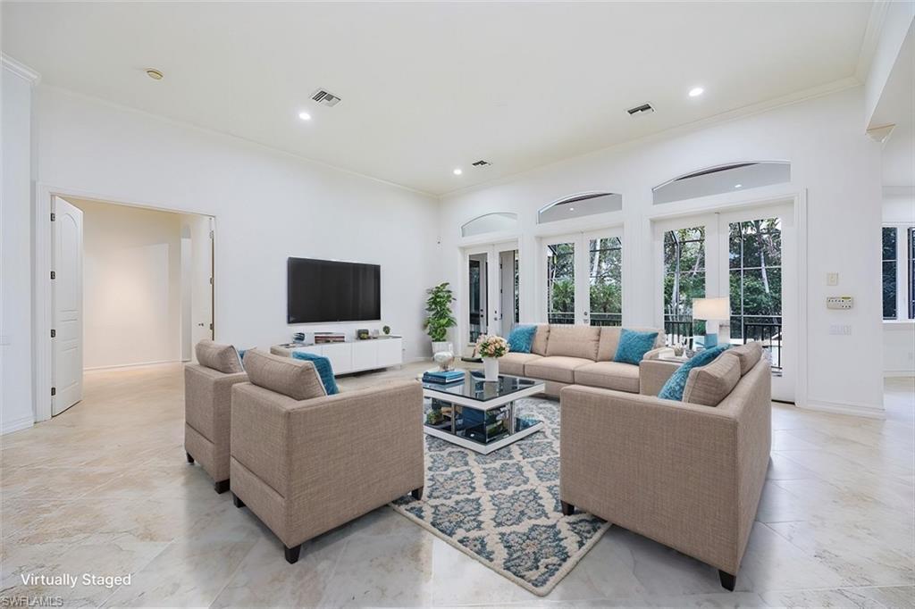 3110 Crayton Road Naples, FL 34103 - Photo 4 of 38 Virtually Staged - Great room with access to the kitchen and the pool/spa/lanai thru french doors.