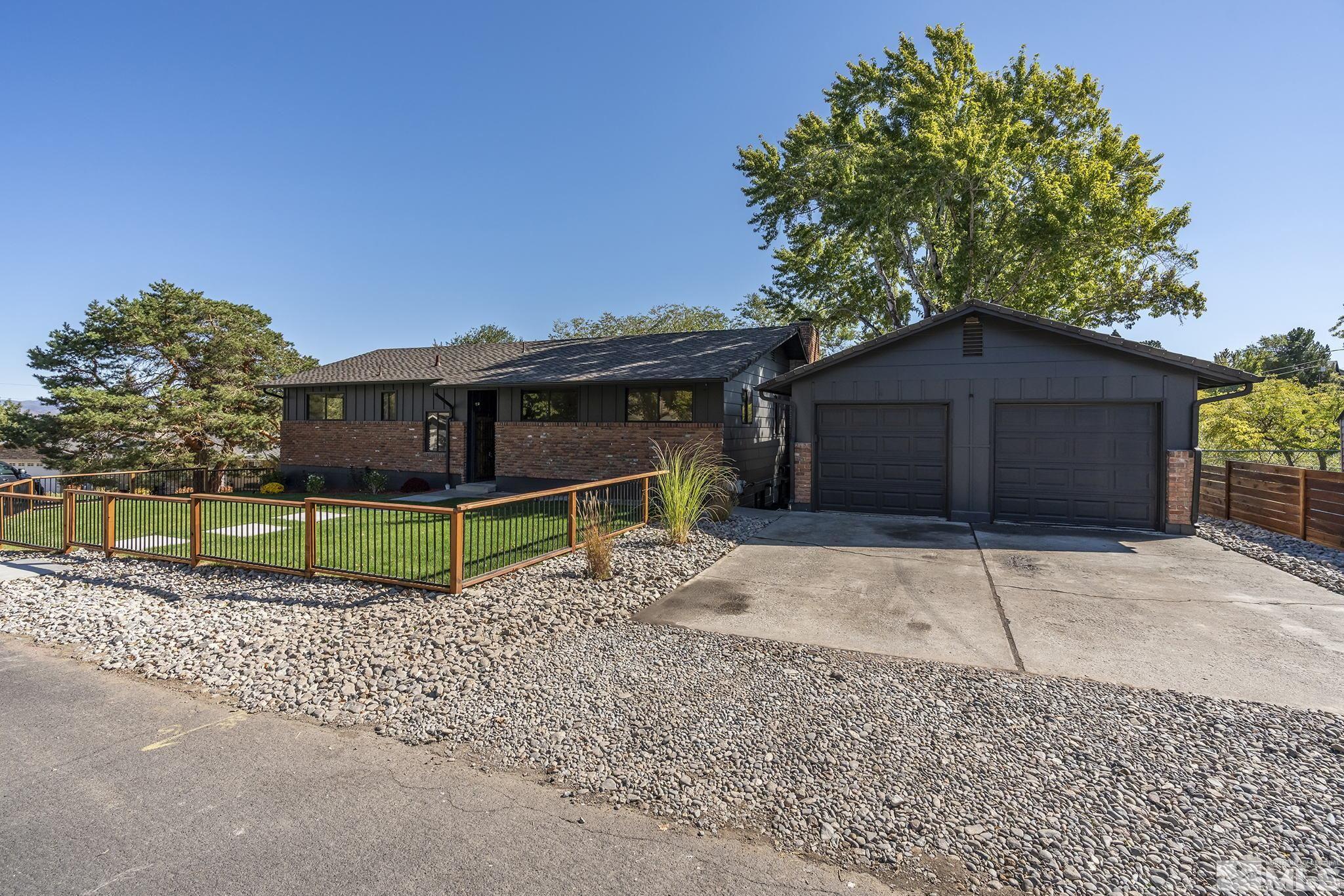 2350 Rodney Drive Reno, NV 89509 - Photo 2 of 40 a house with trees in the background