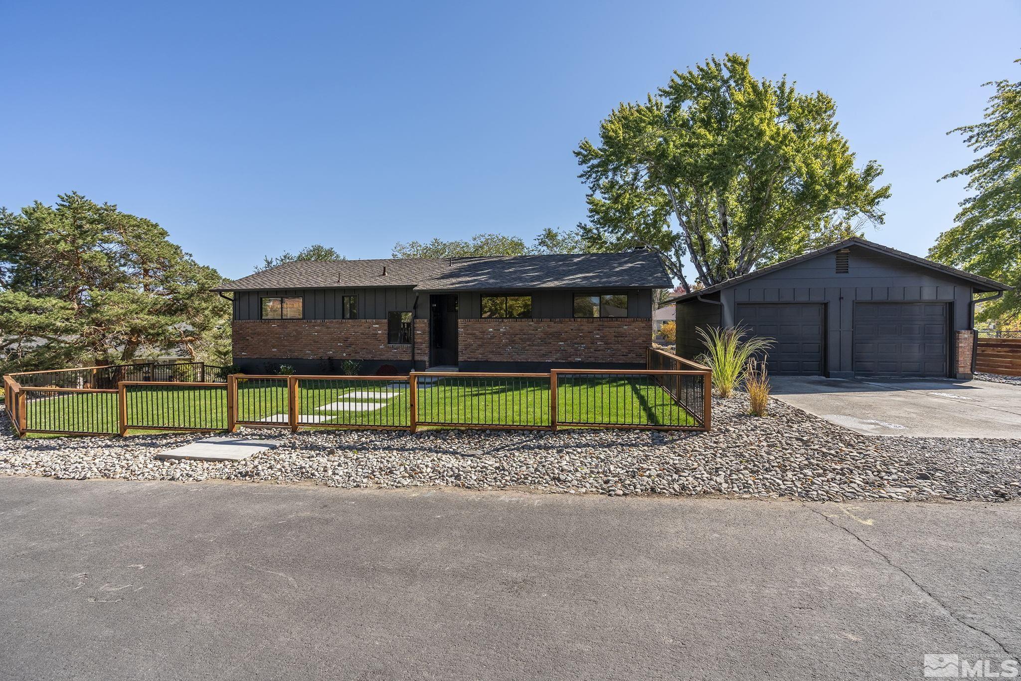 2350 Rodney Drive Reno, NV 89509 - Photo 40 of 40 a house with a small yard and wooden fence