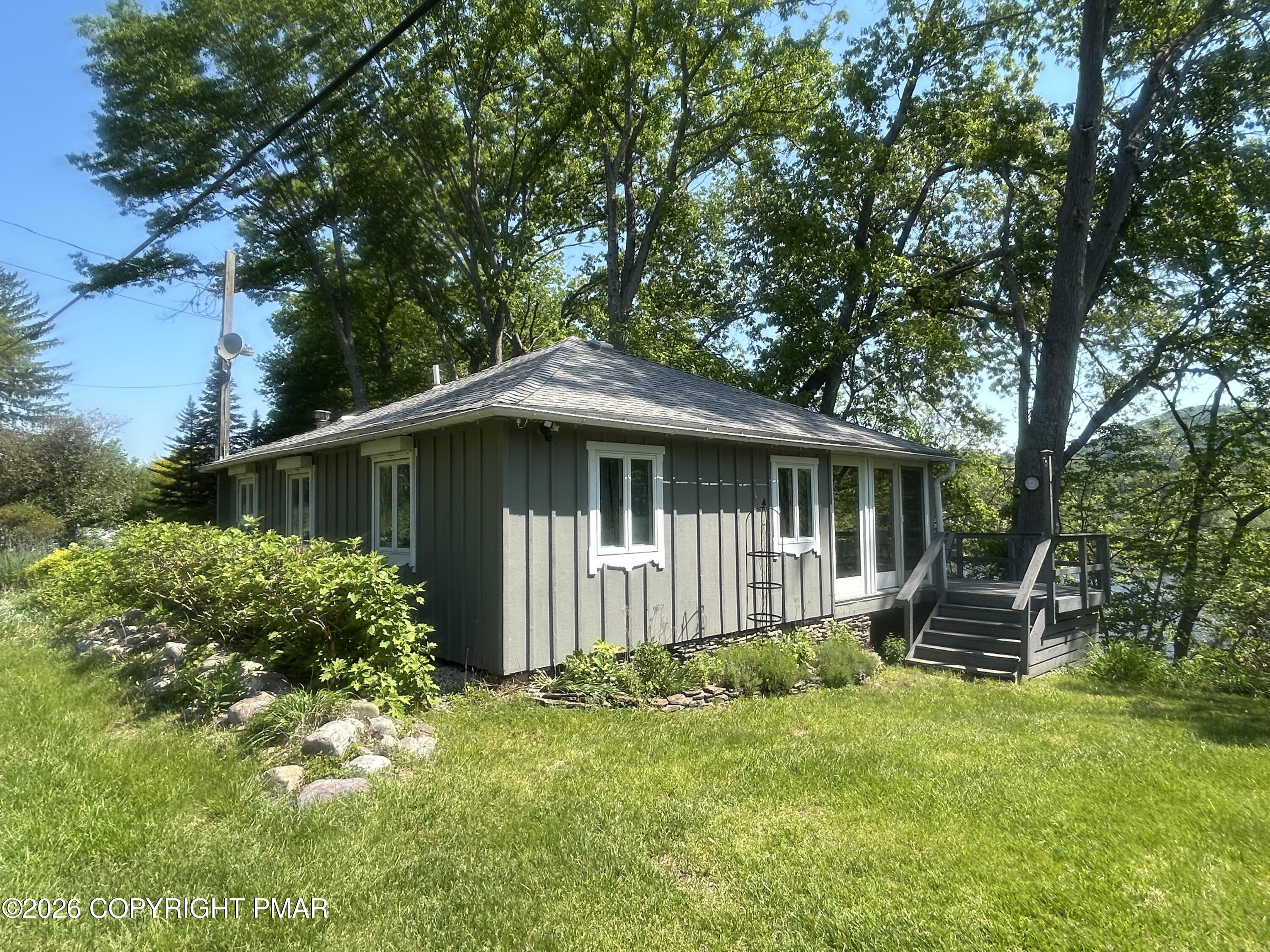 4379 River Road Mount Bethel, PA 18343 - Photo 5 of 48 a front view of a house with garden