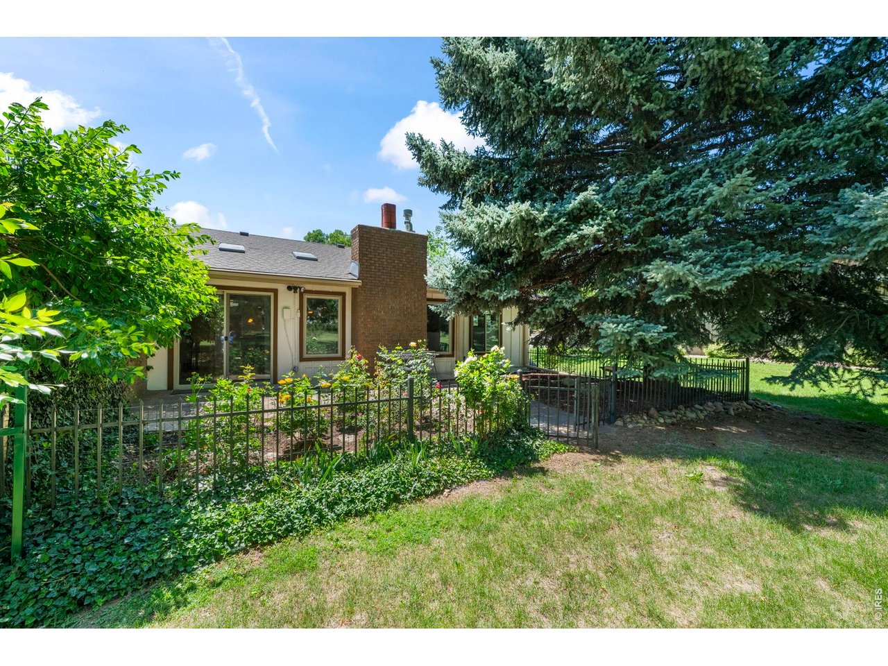 4824 Briar Ridge Court Boulder, CO 80301 - Photo 34 of 40 a view of a house with a yard and a large tree