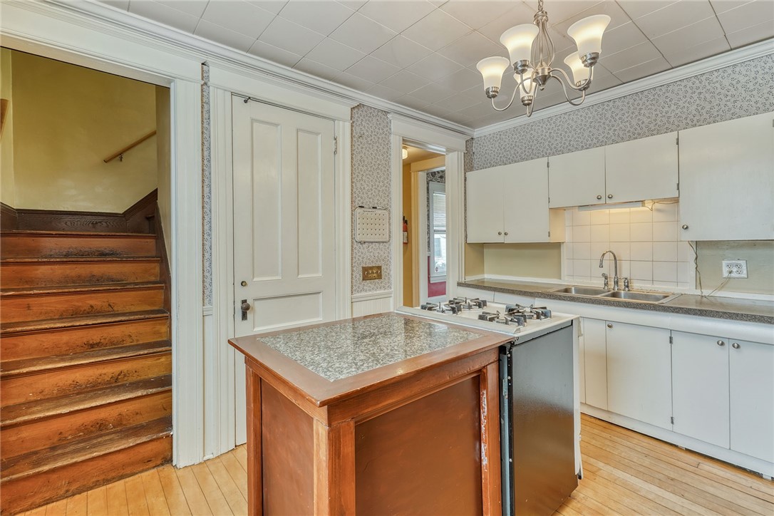 40 Stewart Street Rochester, NY 14620 - Photo 17 of 50 KITCHEN - REAR STAIRCASE TO 2ND LEVEL