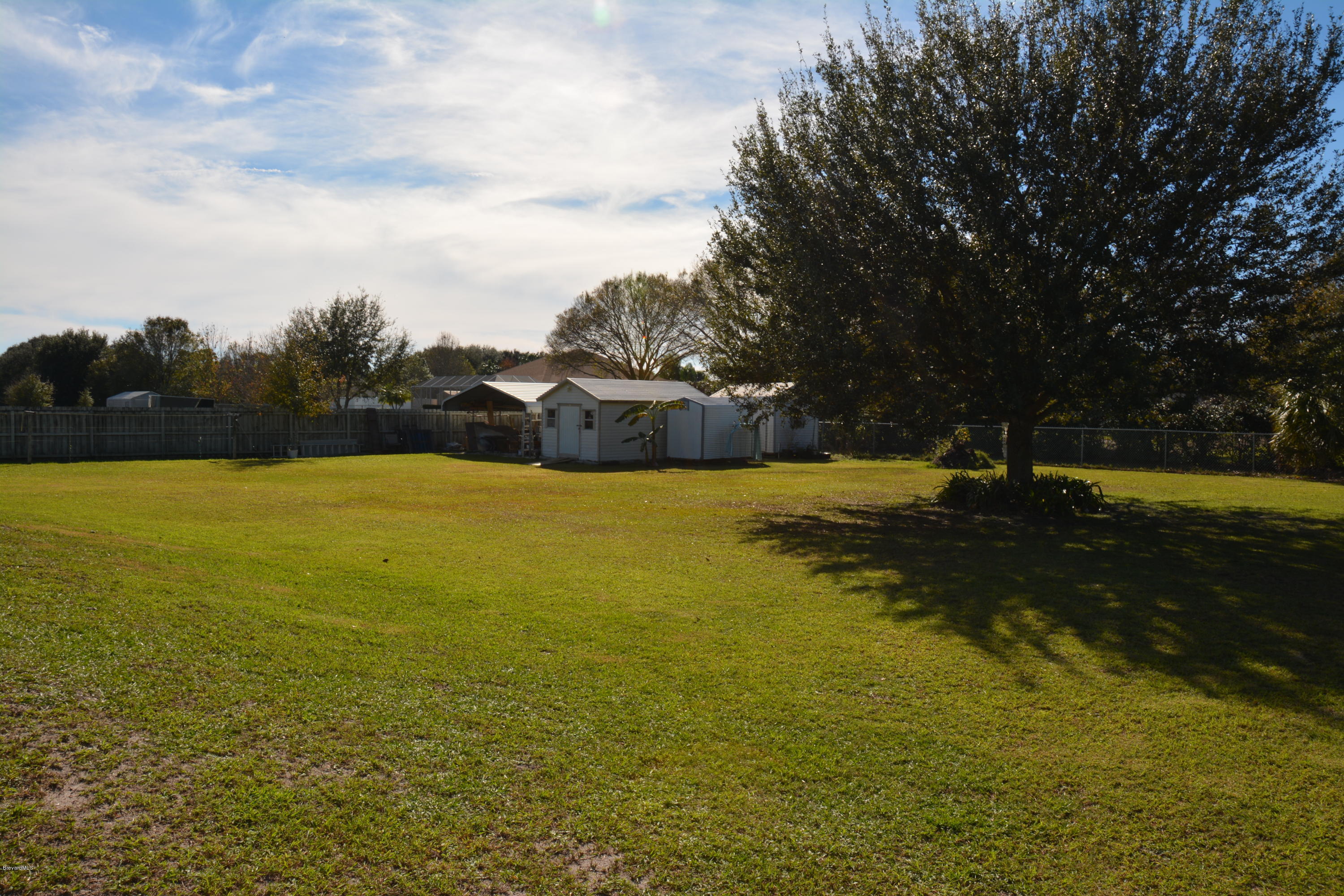 3940 Pine Cone Road Melbourne, FL 32934 - Photo 22 of 28 Huge yard 4 sheds in back