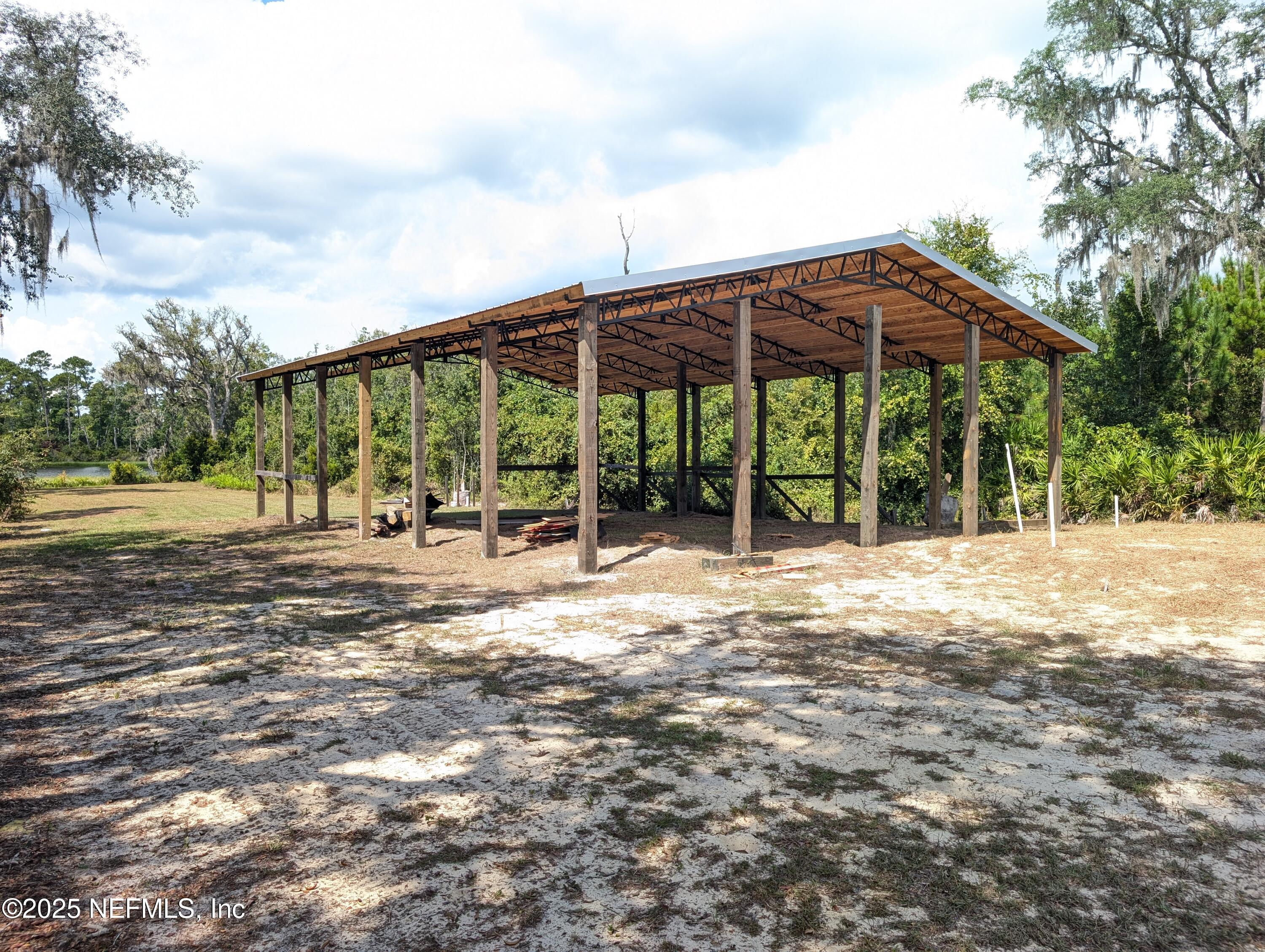 211 Ida Boulevard Interlachen, FL 32148 - Photo 4 of 12 a view of a house with backyard and trees