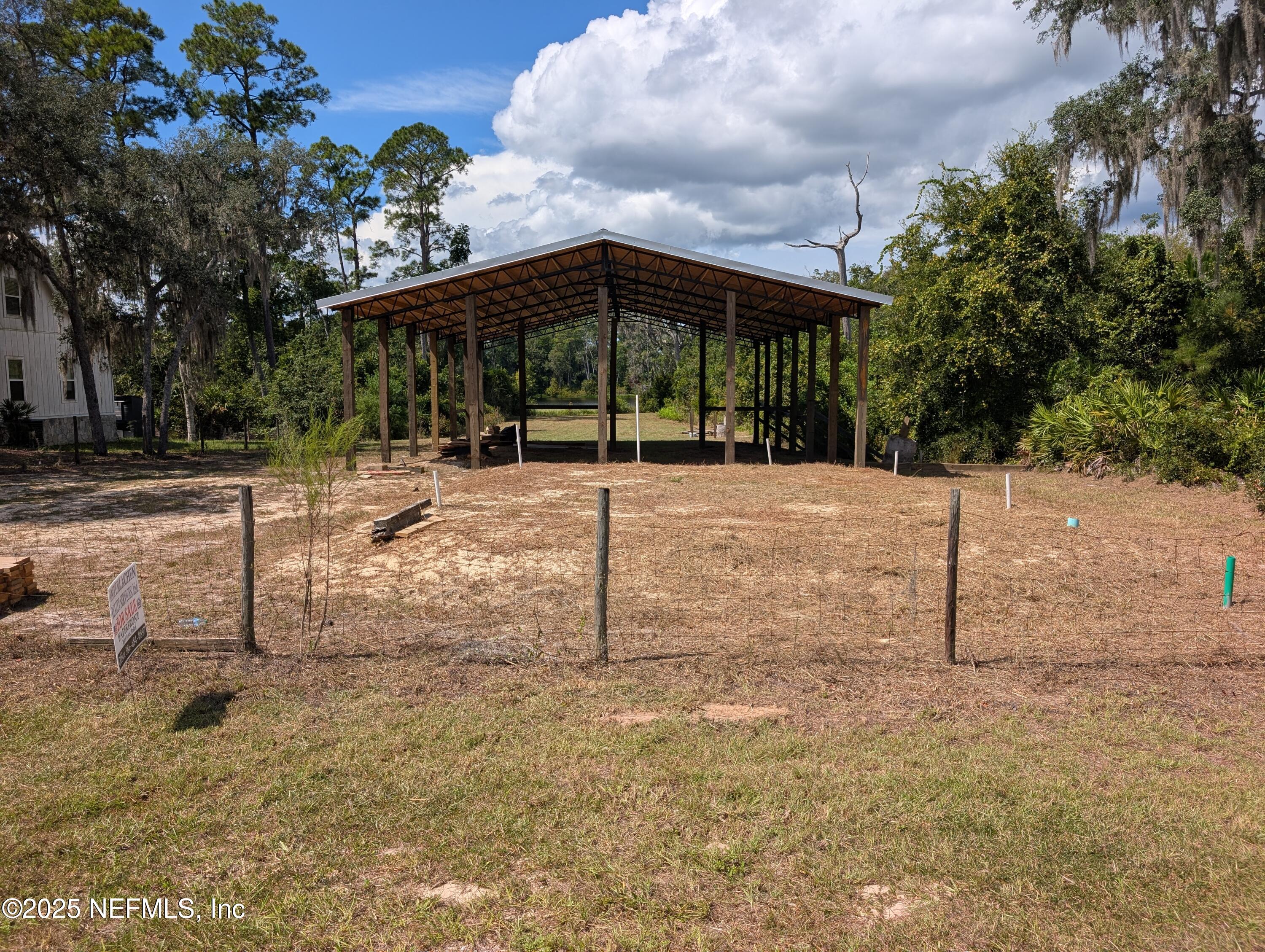 211 Ida Boulevard Interlachen, FL 32148 - Photo 5 of 12 a backyard of a house with lots of green space