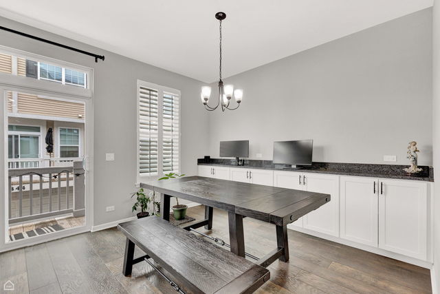 809 Lee Street Des Plaines, IL 60016 - Photo 7 of 18 a workspace with furniture window and wooden floor