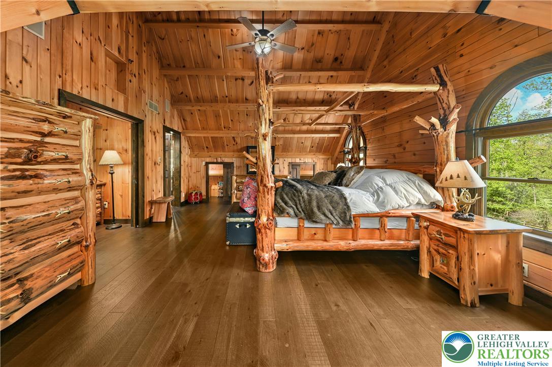 294 Nockamixon Road Kintnersville, PA 18930 - Photo 31 of 58 a view of a room with wooden floor and stairs