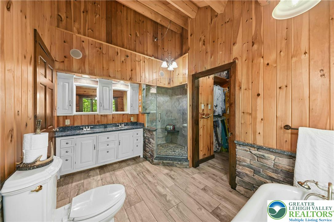 294 Nockamixon Road Kintnersville, PA 18930 - Photo 34 of 58 a bathroom with a sink a toilet and shower