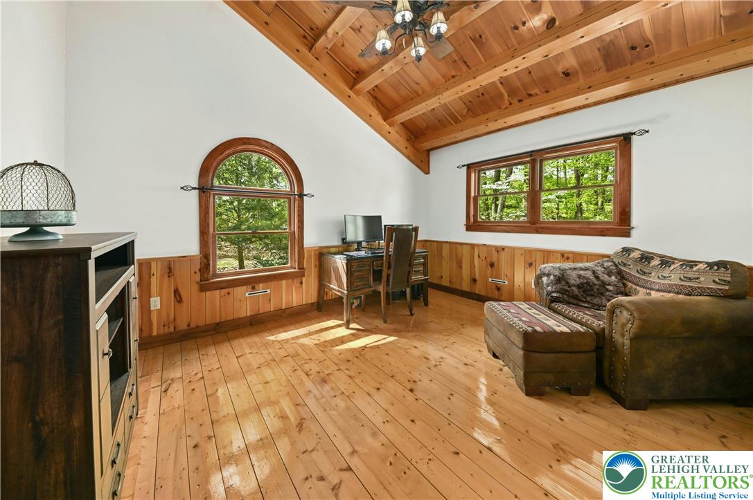 294 Nockamixon Road Kintnersville, PA 18930 - Photo 36 of 58 a living room with furniture and a large window
