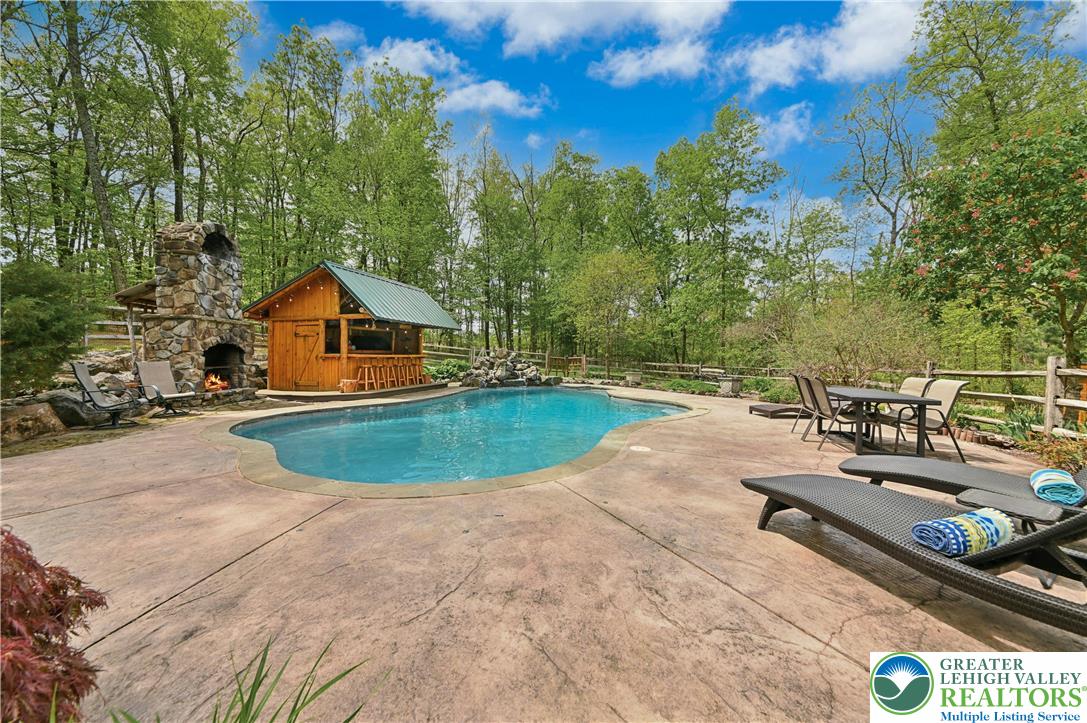 294 Nockamixon Road Kintnersville, PA 18930 - Photo 46 of 58 a view of a swimming pool with a patio