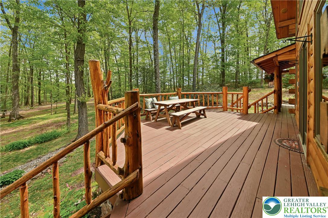 294 Nockamixon Road Kintnersville, PA 18930 - Photo 8 of 58 a view of balcony with wooden floor and outdoor seating