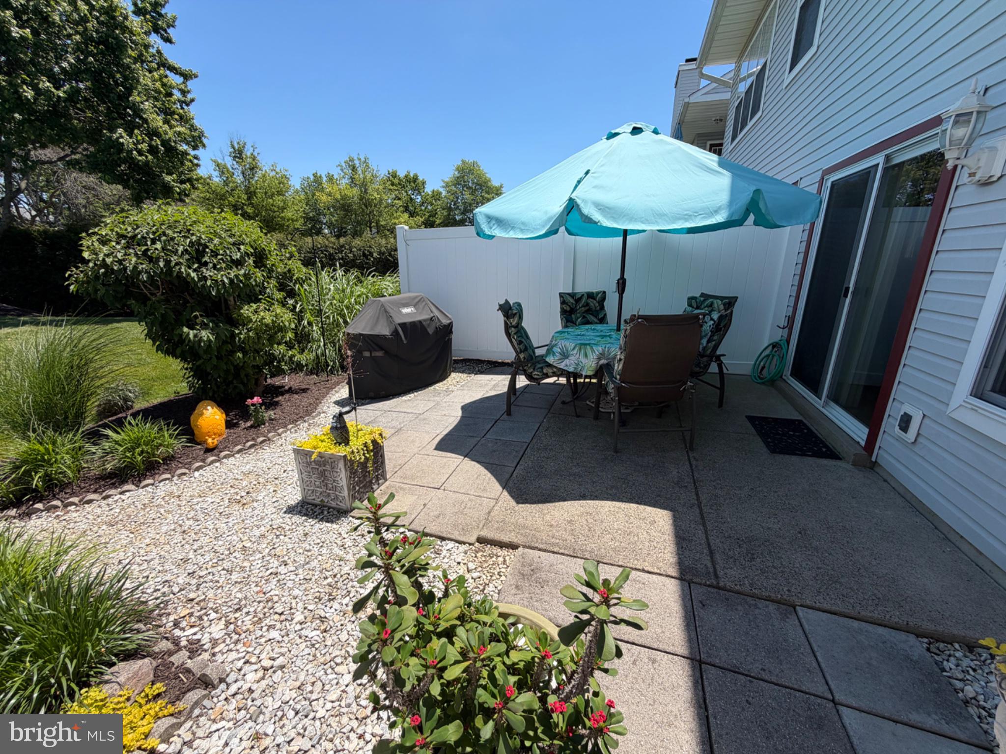 2703 Sterling Road Yardley, PA 19067 - Photo 38 of 41 Sunny patio oasis with lush greenery.