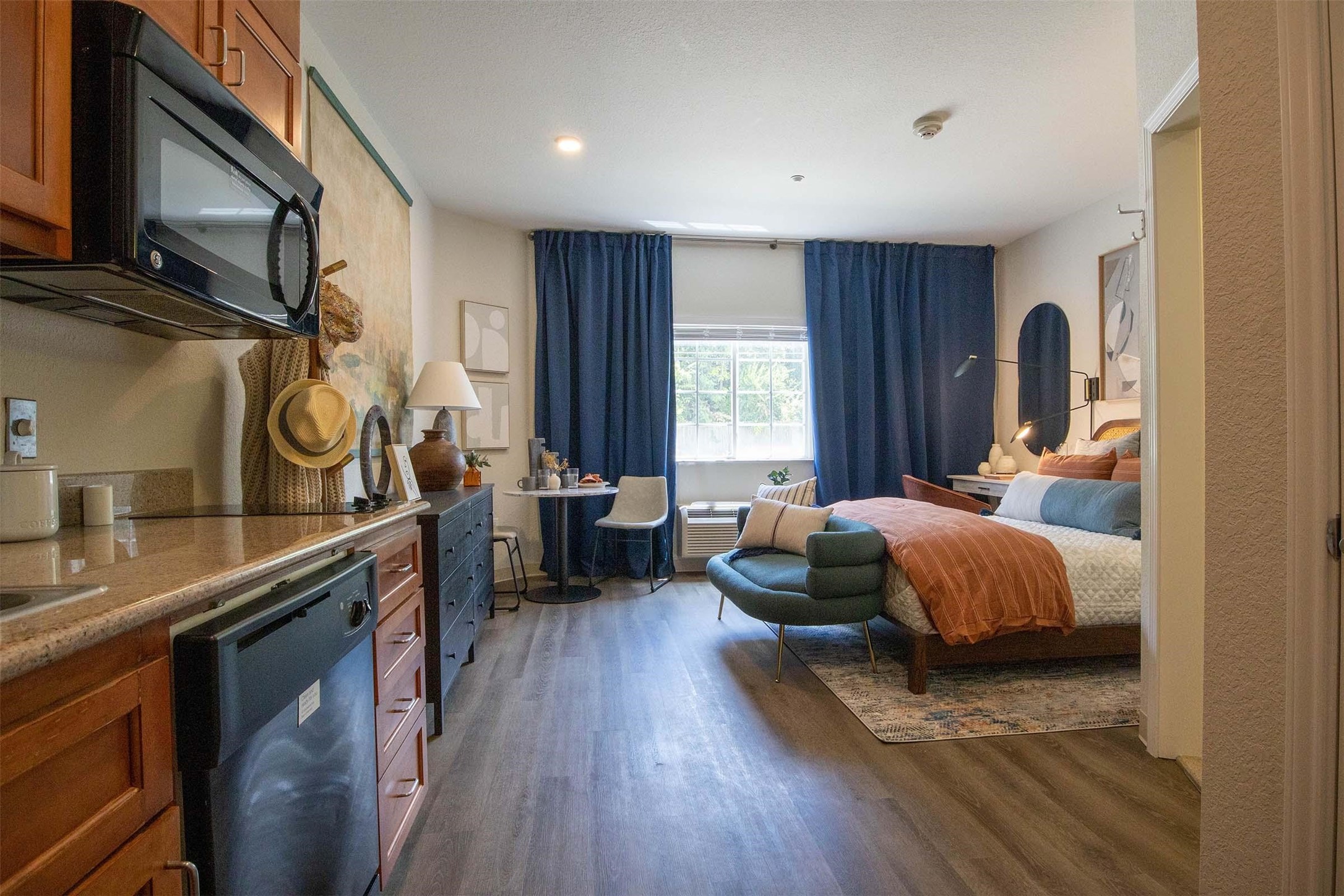 8719 Farm Market 1960 West Road, Unit 214 Houston, TX 77065 - Photo 28 of 50 a bedroom with a bed and wooden floor